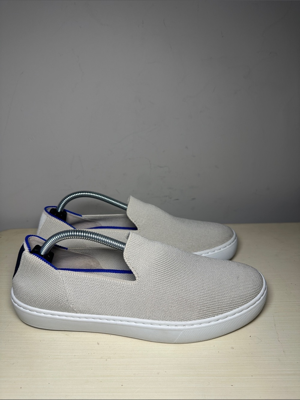 Rothy’s Light Beige Slip-On Sneakers with Blue Trim